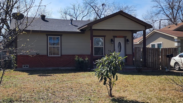 bungalow-style home featuring a front yard