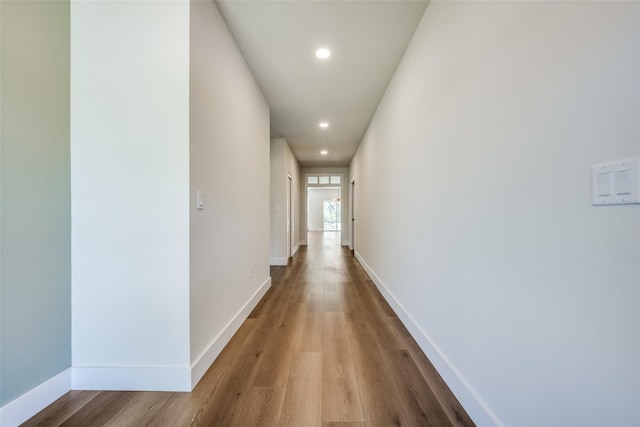 hall with wood-type flooring