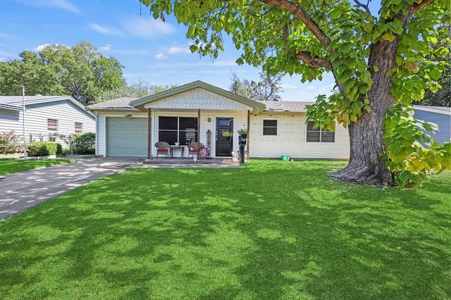 single story home featuring a garage, a front lawn, and a porch