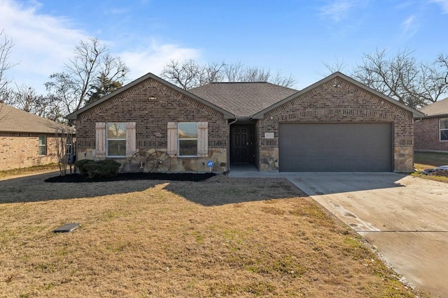 ranch-style house featuring a garage and a front lawn