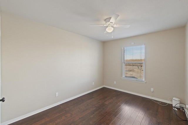 empty room with baseboards, a ceiling fan, and wood finished floors