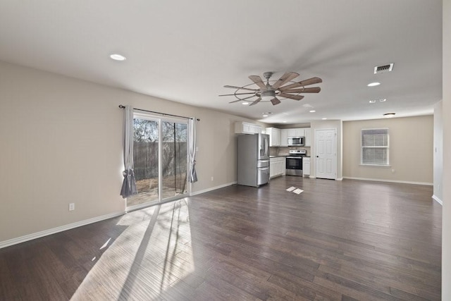 unfurnished living room featuring visible vents, recessed lighting, ceiling fan, dark wood-style floors, and baseboards