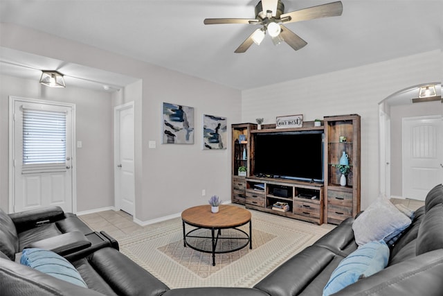 living room featuring light tile patterned floors and ceiling fan