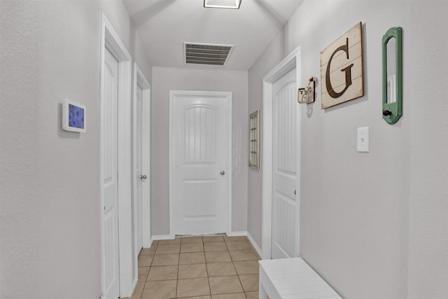 hallway with light tile patterned floors