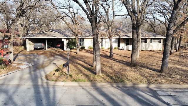 single story home featuring a carport