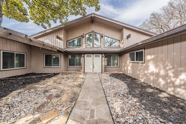 doorway to property with a patio area