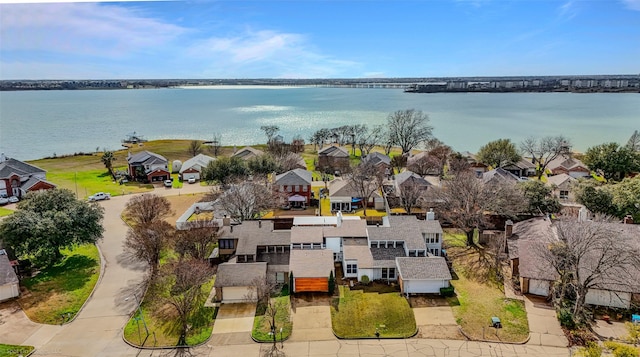 bird's eye view featuring a water view and a residential view