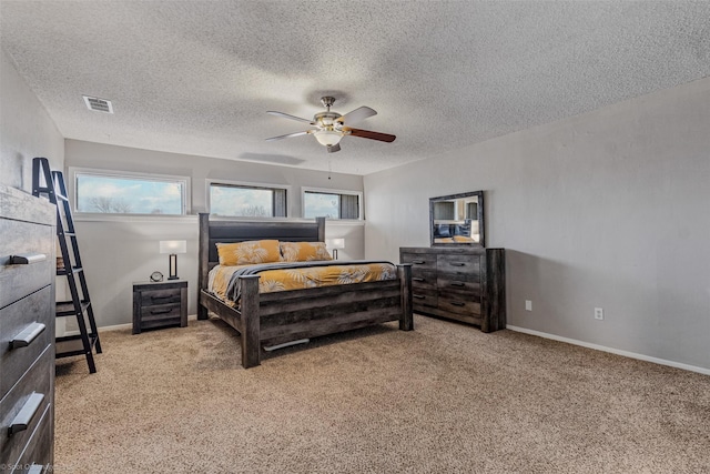 living area featuring ceiling fan, carpet floors, a textured ceiling, and baseboards