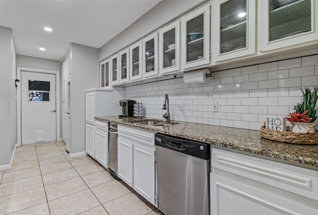 kitchen with under cabinet range hood, tasteful backsplash, stainless steel appliances, and a sink