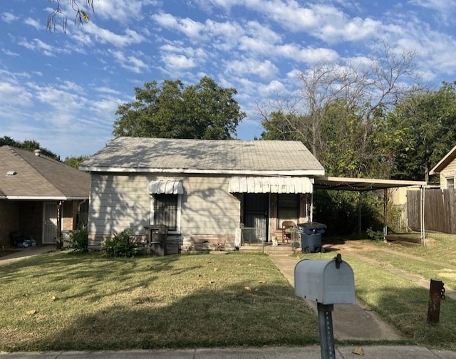 bungalow-style house featuring a front yard