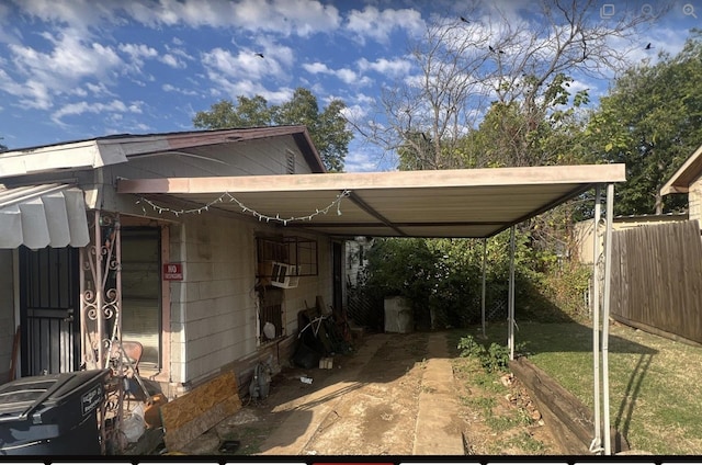 view of patio with cooling unit and a carport