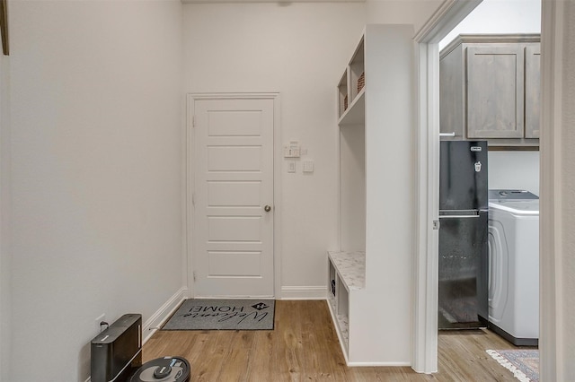 517 Ramon St, Burleson, TX 76028 - mudroom with washer / dryer and light wood-style flooring