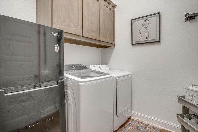 517 Ramon St, Burleson, TX 76028 - laundry area with washing machine and dryer and cabinet space