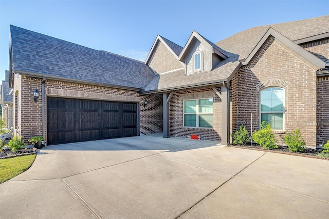 517 Ramon St, Burleson, TX 76028 - french country inspired facade with brick siding, a garage, concrete driveway, and roof with shingles