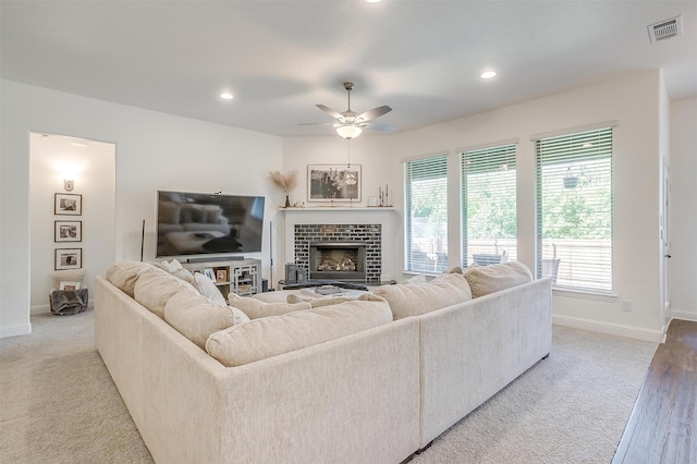 517 Ramon St, Burleson, TX 76028 - carpeted living area featuring ceiling fan, recessed lighting, and a tiled fireplace