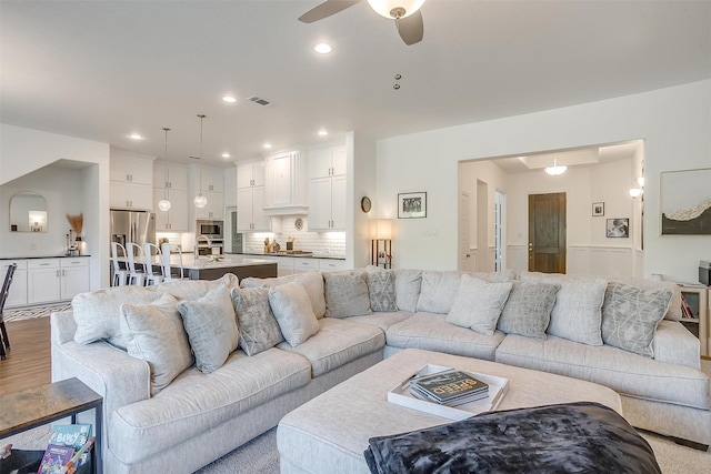 517 Ramon St, Burleson, TX 76028 - living room with ceiling fan, wood finished floors, recessed lighting, and wainscoting