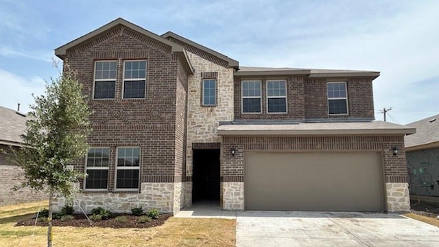 traditional-style house featuring stone siding, a garage, brick siding, and driveway