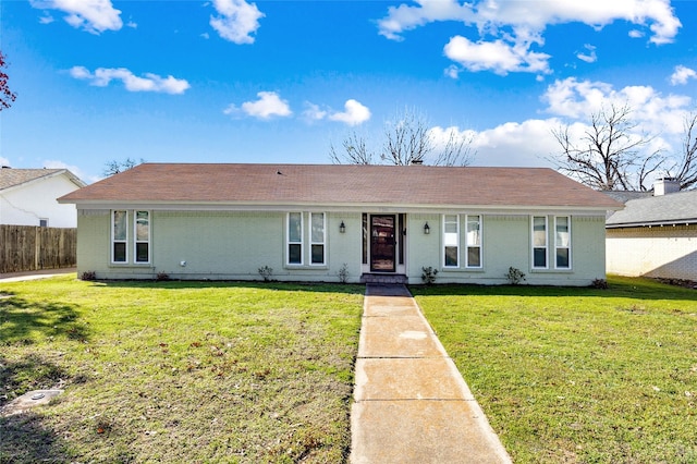 single story home with a front yard