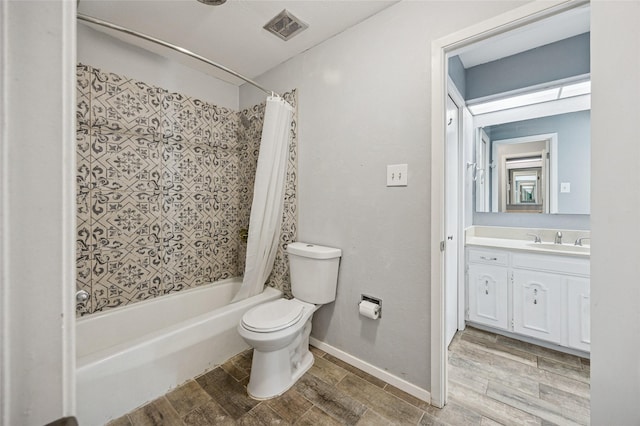 7316 Martha Ln, Fort Worth, TX 76112 - full bathroom featuring toilet, shower / bath combo, vanity, wood finished floors, and baseboards