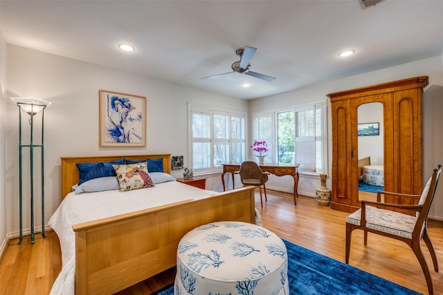 bedroom featuring ceiling fan and light hardwood / wood-style flooring