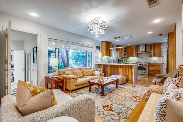 living room with light hardwood / wood-style flooring