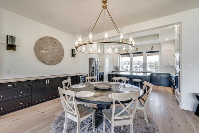 2770 Fireside Dr, Midlothian, TX 76065 - dining room with a chandelier and light wood-type flooring