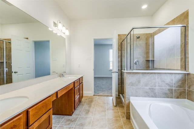 3917 Belleview Pl, Crandall, TX 75114 - bathroom with a garden tub, tile patterned floors, a sink, a stall shower, and double vanity