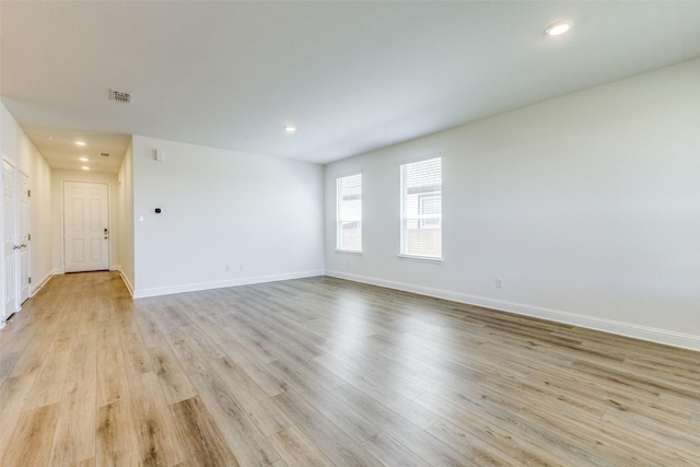 3917 Belleview Pl, Crandall, TX 75114 - unfurnished room with recessed lighting, light wood-style floors, visible vents, and baseboards
