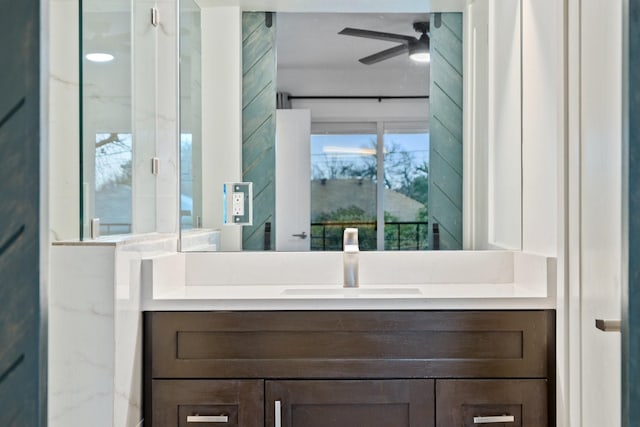 bathroom featuring ceiling fan and vanity