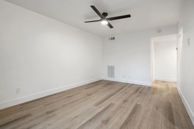 spare room with light hardwood / wood-style floors and ceiling fan