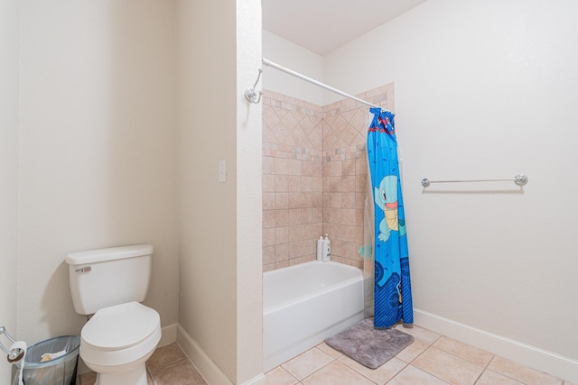 bathroom featuring tile patterned floors, shower / bathtub combination with curtain, and toilet