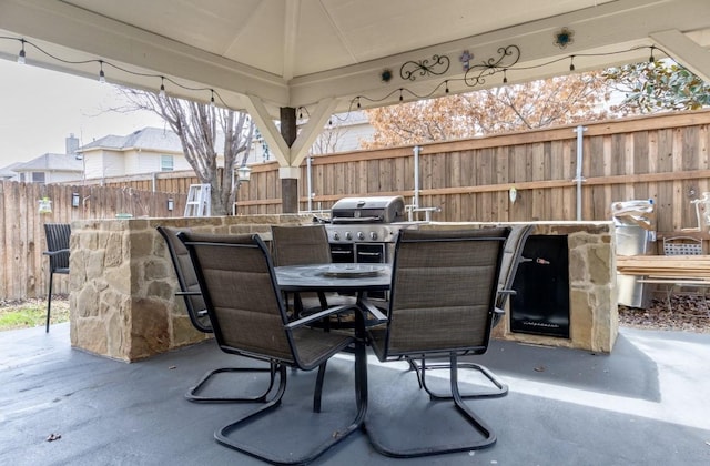 view of patio with a gazebo and a bar