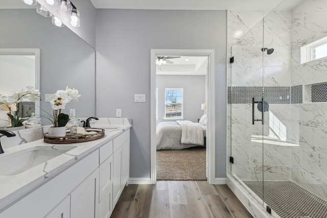 bathroom featuring vanity, a shower with door, and hardwood / wood-style floors