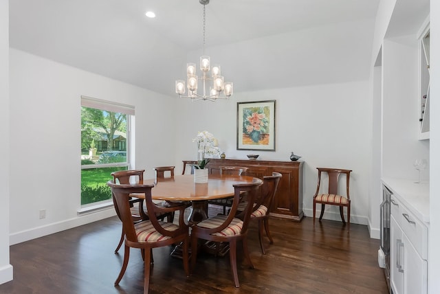 dining room with baseboards, lofted ceiling, dark wood-style flooring, a notable chandelier, and recessed lighting