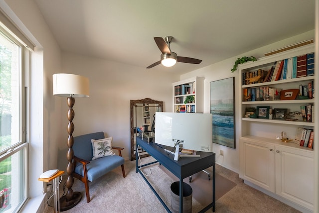 office area with ceiling fan and light colored carpet