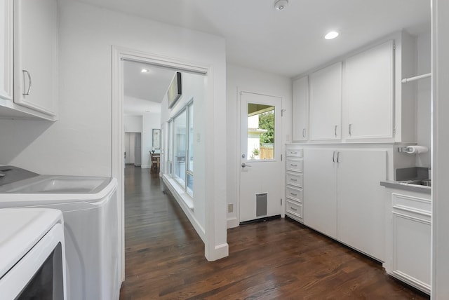 clothes washing area with cabinet space, baseboards, washer and clothes dryer, dark wood-type flooring, and recessed lighting