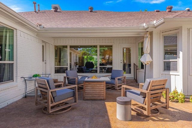 view of patio featuring an outdoor fire pit