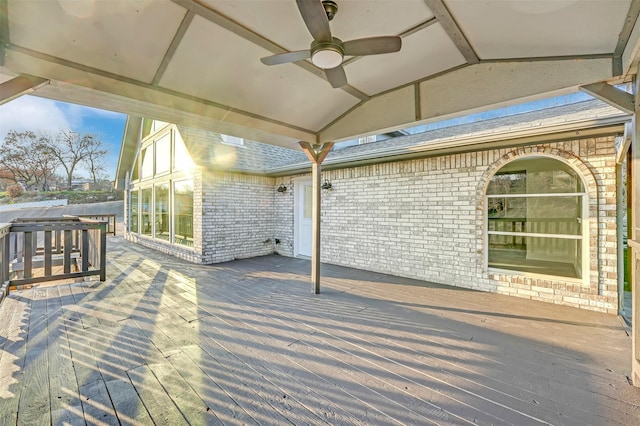 wooden deck featuring ceiling fan