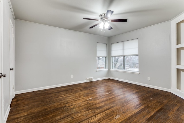 unfurnished room with ceiling fan and dark hardwood / wood-style flooring