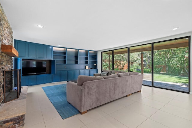 tiled living room with a wall of windows