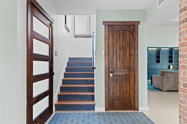 staircase with tile patterned flooring