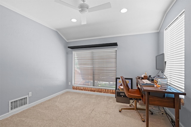 carpeted home office featuring ceiling fan and crown molding