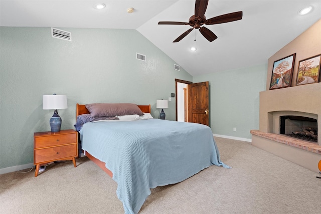 bedroom featuring ceiling fan, vaulted ceiling, and carpet floors