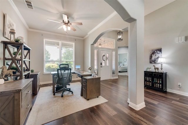 office space featuring arched walkways, dark wood-style flooring, visible vents, ornamental molding, and baseboards