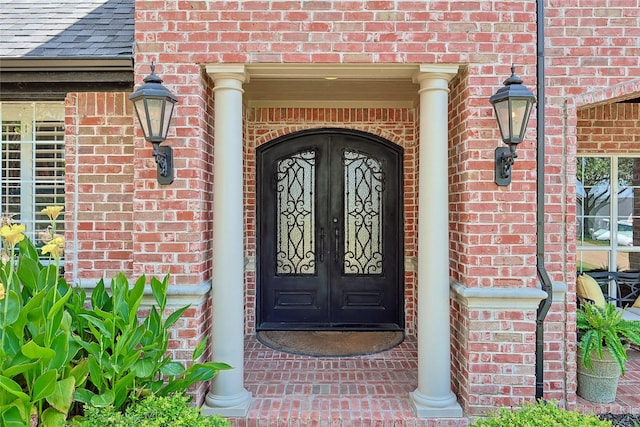 property entrance featuring french doors