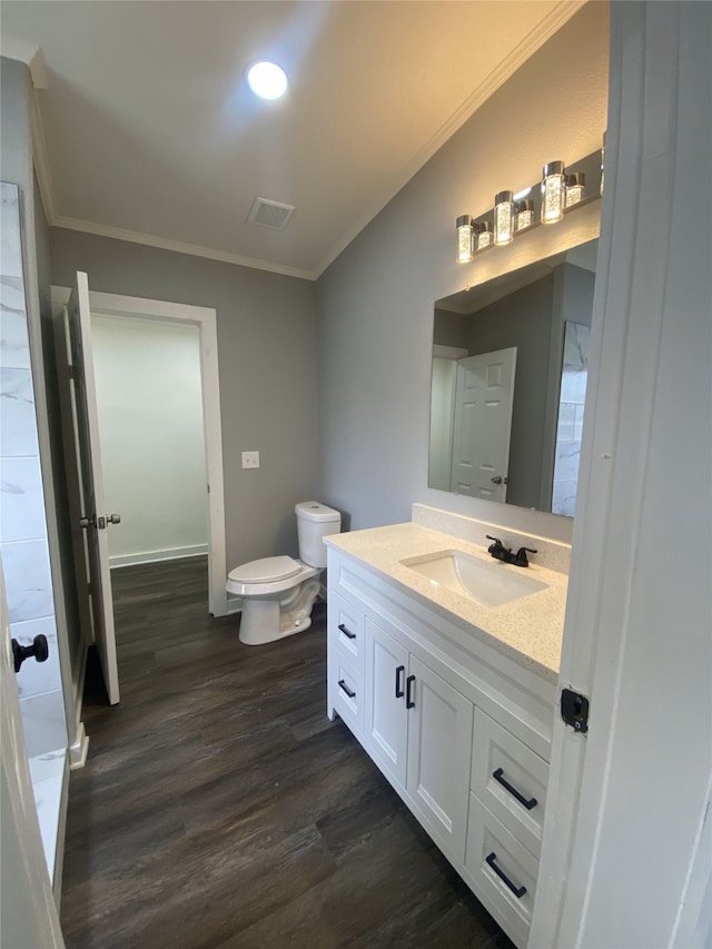 207 County Road 2005, Corsicana, TX 75110 - bathroom with ornamental molding, vanity, hardwood / wood-style floors, and toilet