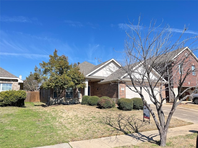 view of front facade featuring a front yard and a garage