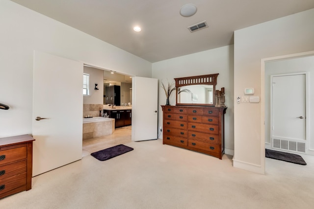 2123 Albany St, Dallas, TX 75201 - bedroom featuring connected bathroom, sink, and light colored carpet