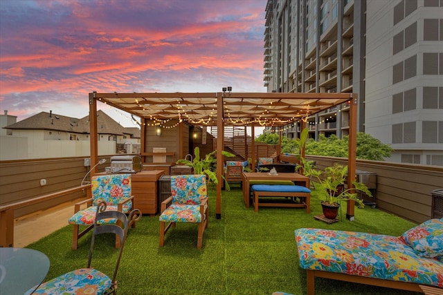 2123 Albany St, Dallas, TX 75201 - patio terrace at dusk featuring a pergola, an outdoor hangout area, and a lawn