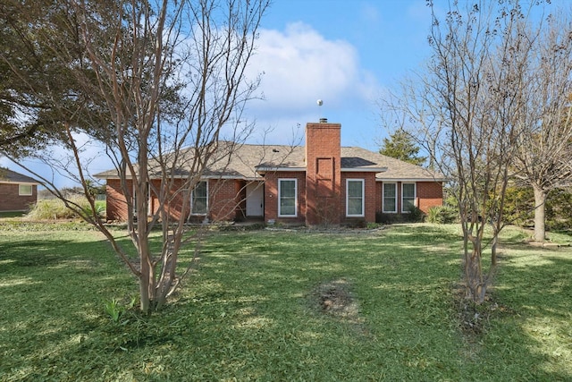 ranch-style home with a front yard